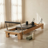 94.5"Pilates Reformer, Wooden Foldable Reformer Pilates Machine with Springs, Quick-Assembly Studio Grade Pilates Reformer Machine, Pilates Equipment with Sitting Box, Jump Board for Home Use & Studio — Studio Shot